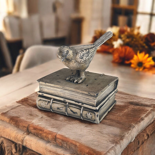 Bird perched on books